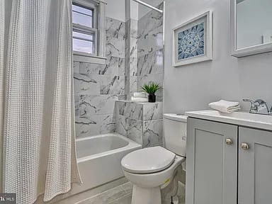 Bathroom remodel with custom tile and updated fixtures